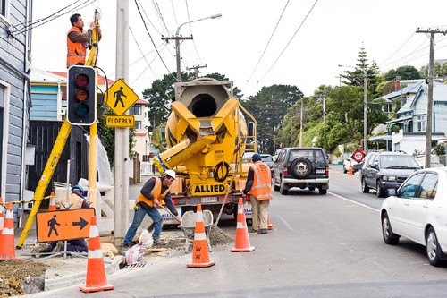 Council contractors installing traffic lights. 